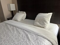 Four little travel pillows for a king bed.