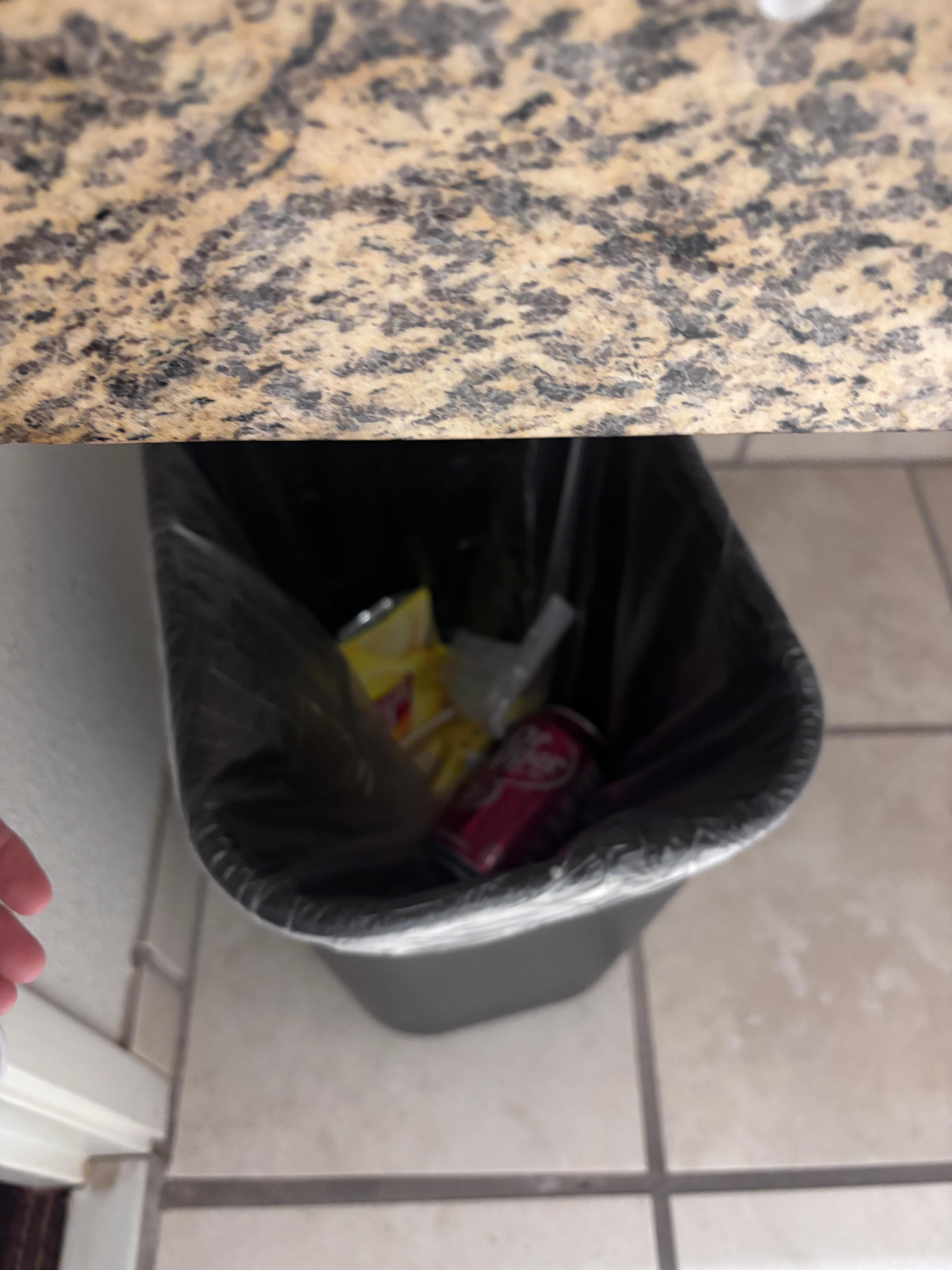Trash that was not ours in the bathroom trashcan 