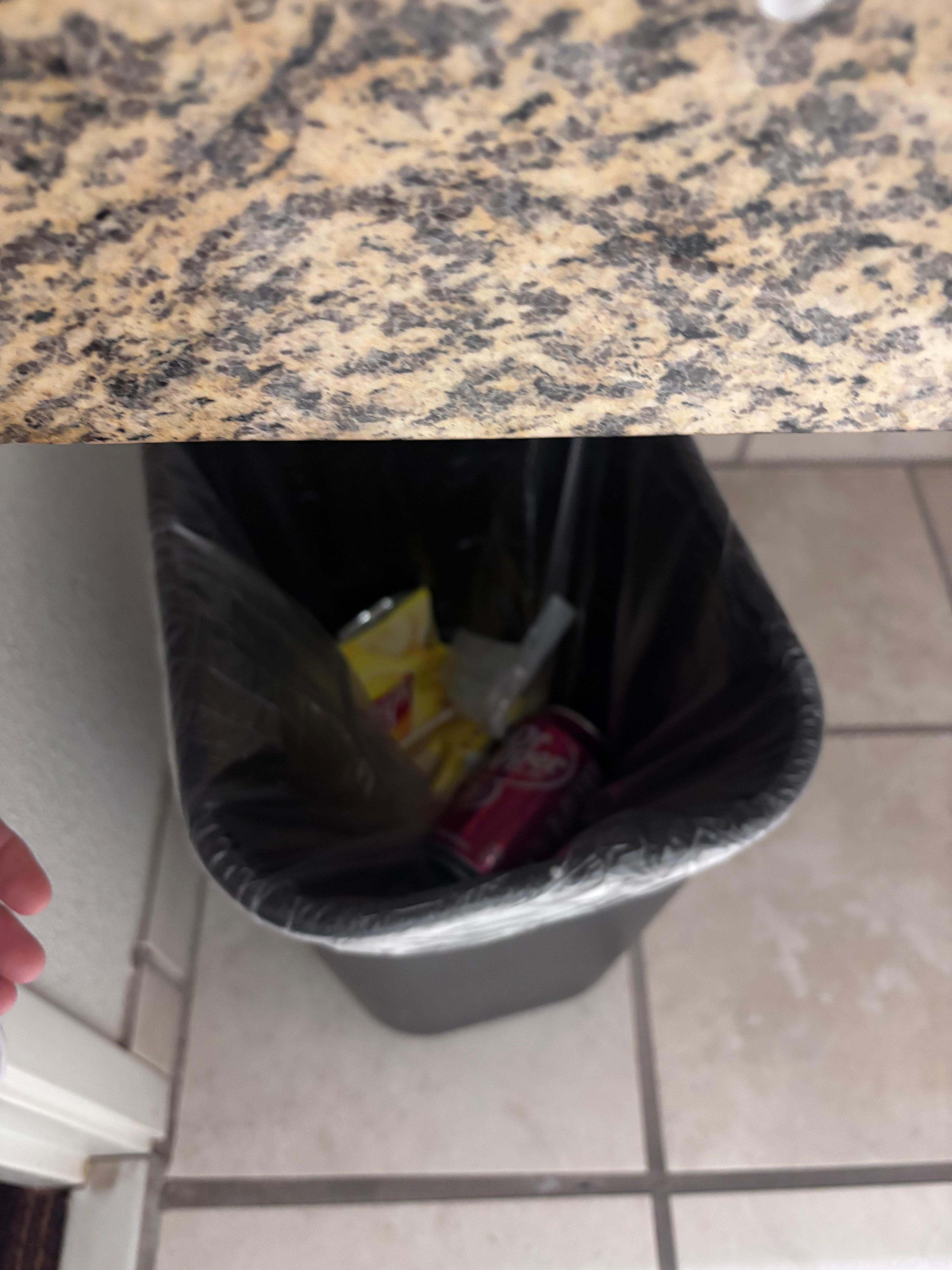 Trash that was not ours in the bathroom trashcan 