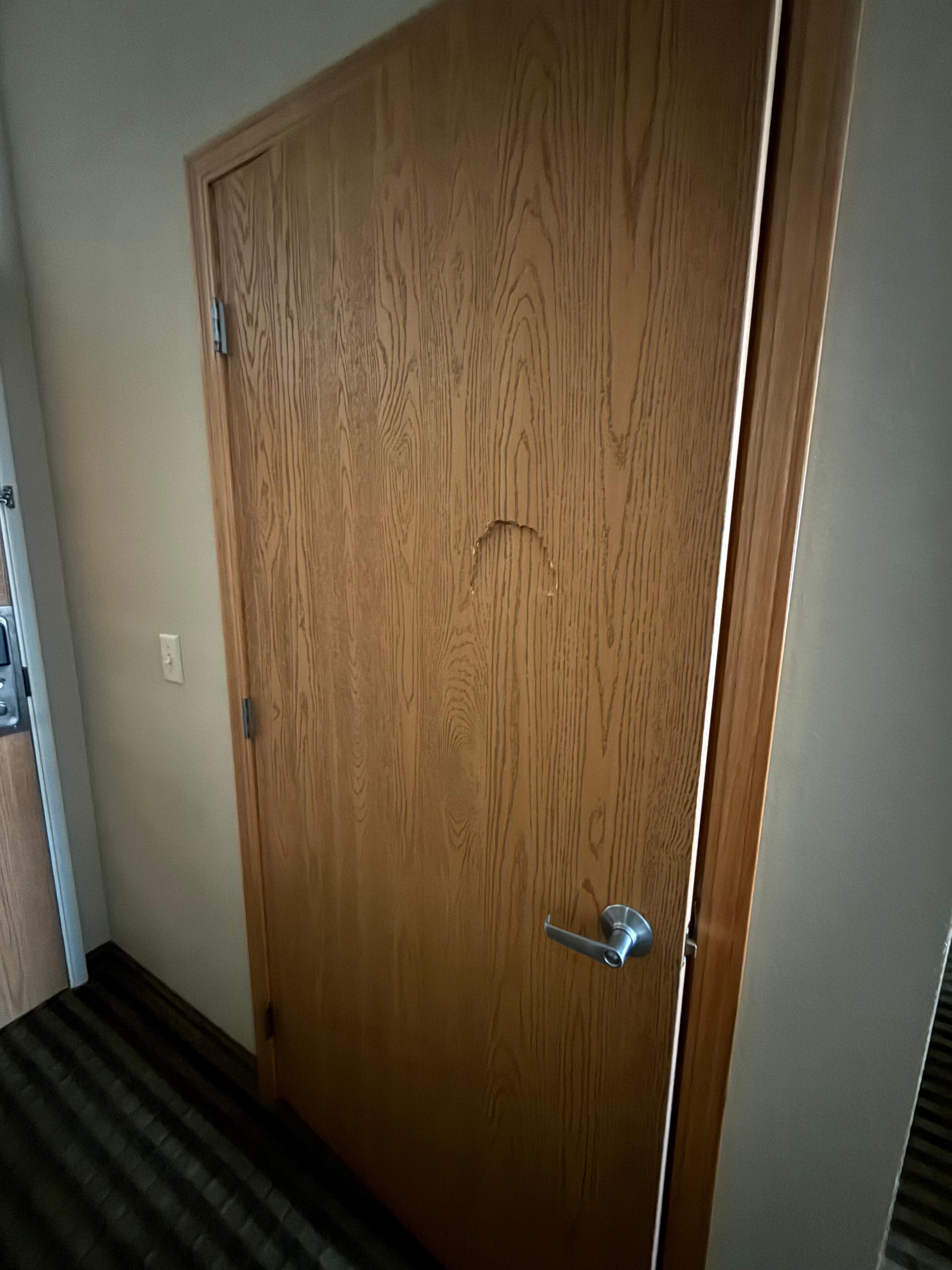 Punch hole in toilet door