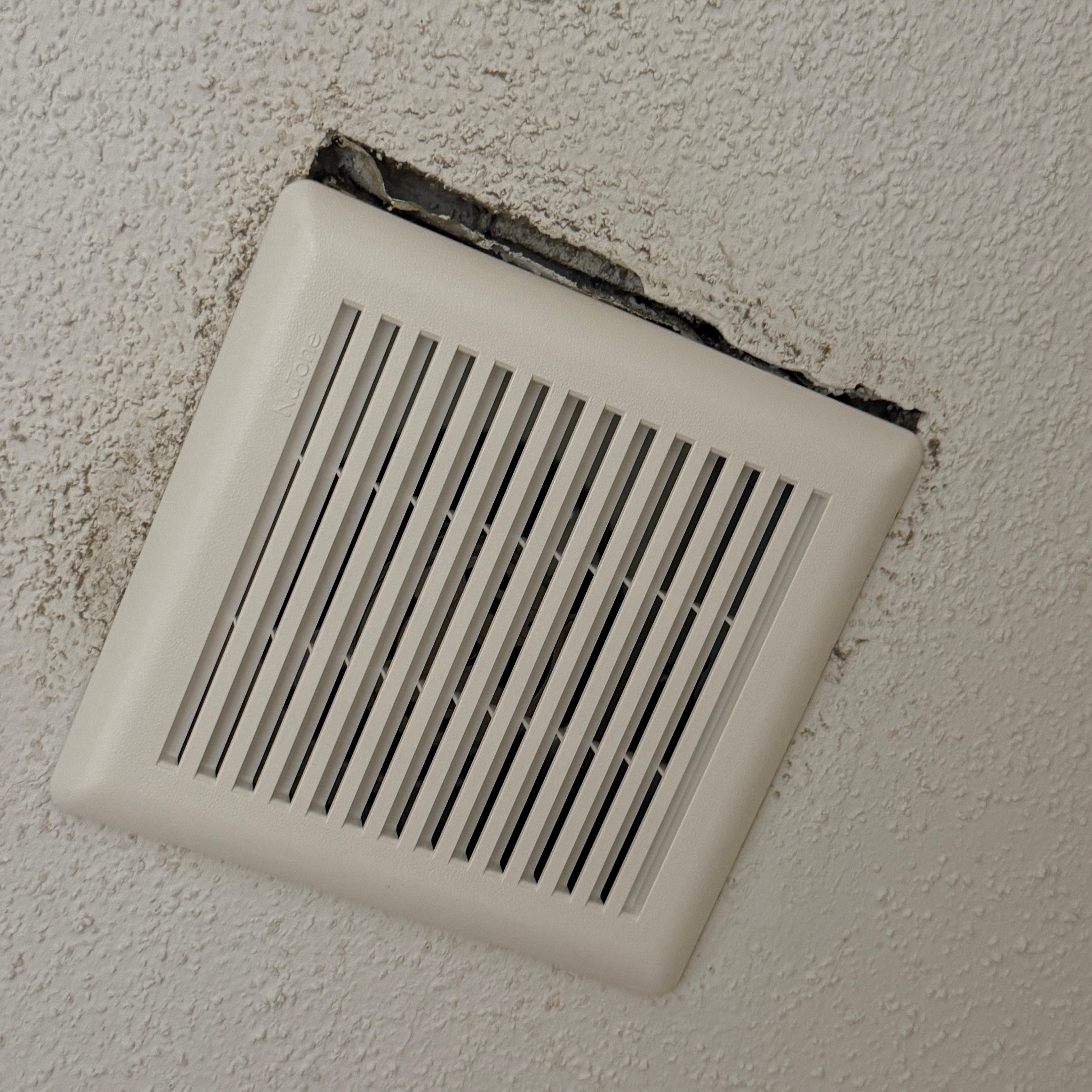 Hole in ceiling by bathroom vent. 