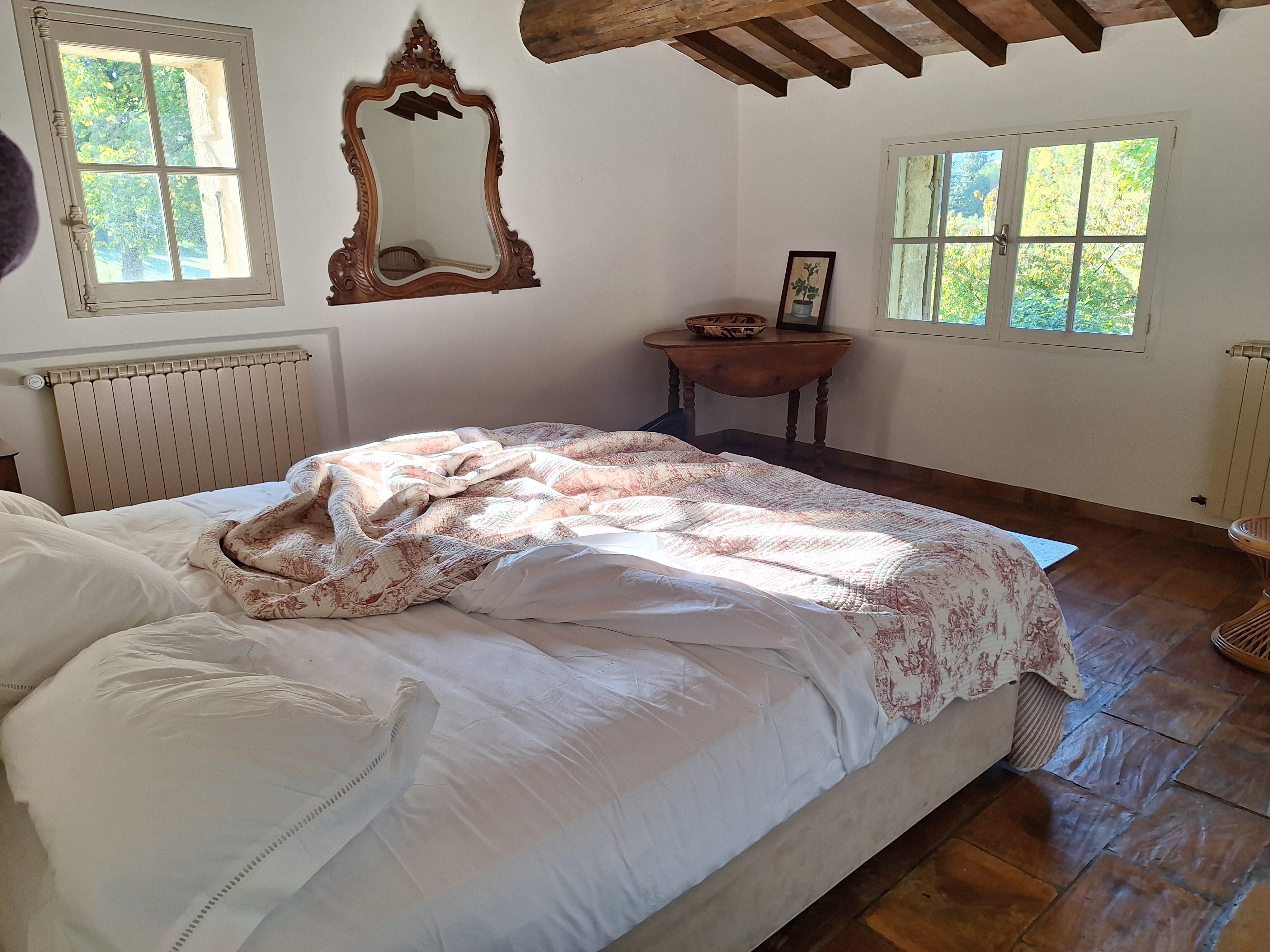 Lovely primary suite with beautiful light, and charming simplicity