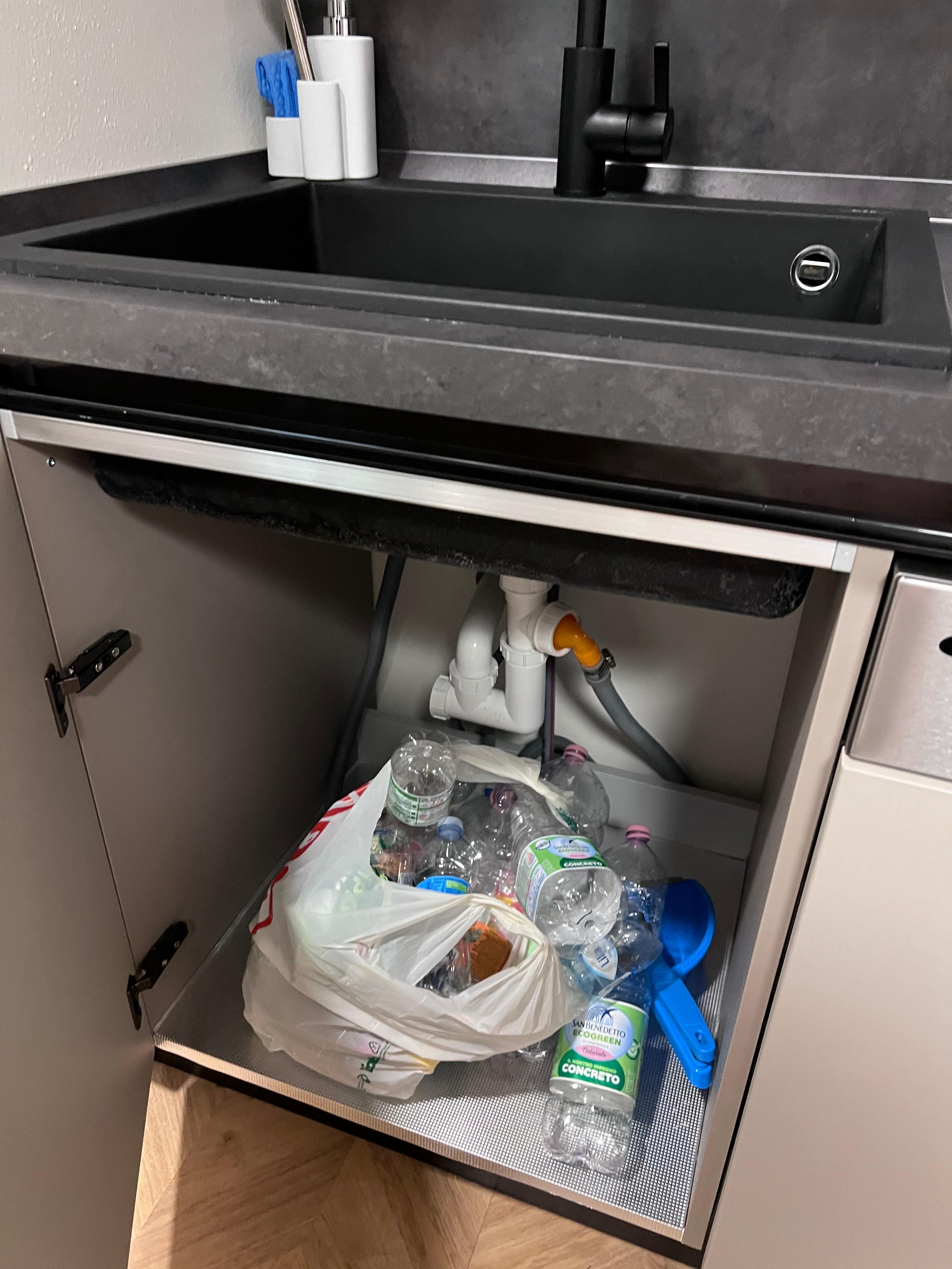 Trash left under sink