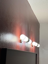 Dust on wall above headboard