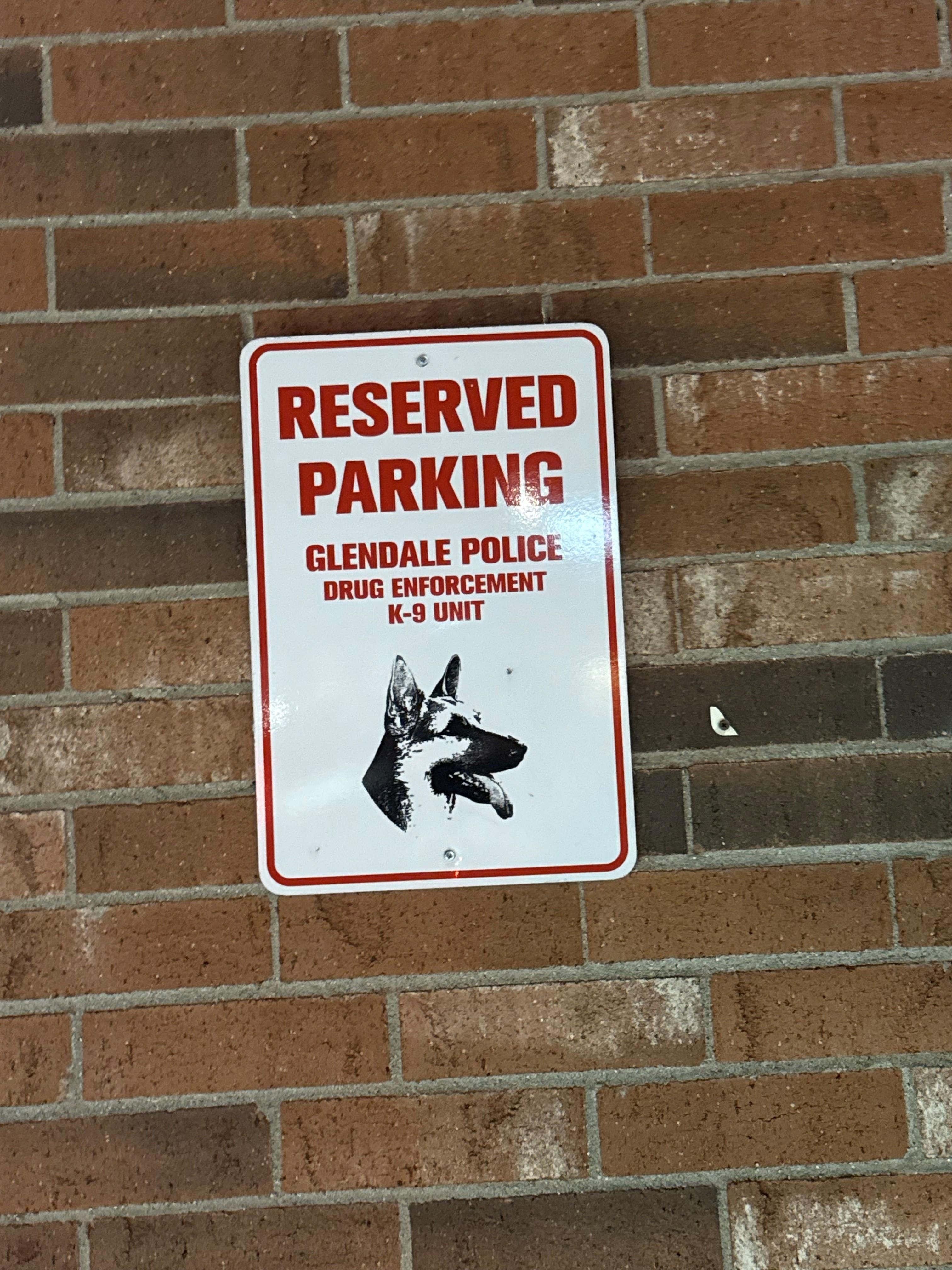 Reserved parking spot for local police (because they're there so much)