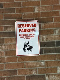 Reserved parking spot for local police (because they're there so much)