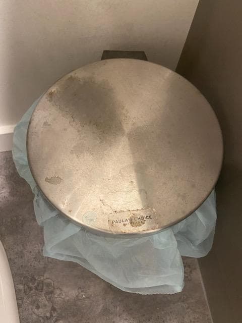 Bathroom garbage can lid filthy. We took this as a clear example of how dirty the house was. All of the floors were dirty but the photos we took couldn't show this well. We had to carefully select only 8 photos to post as that is the max. allowed