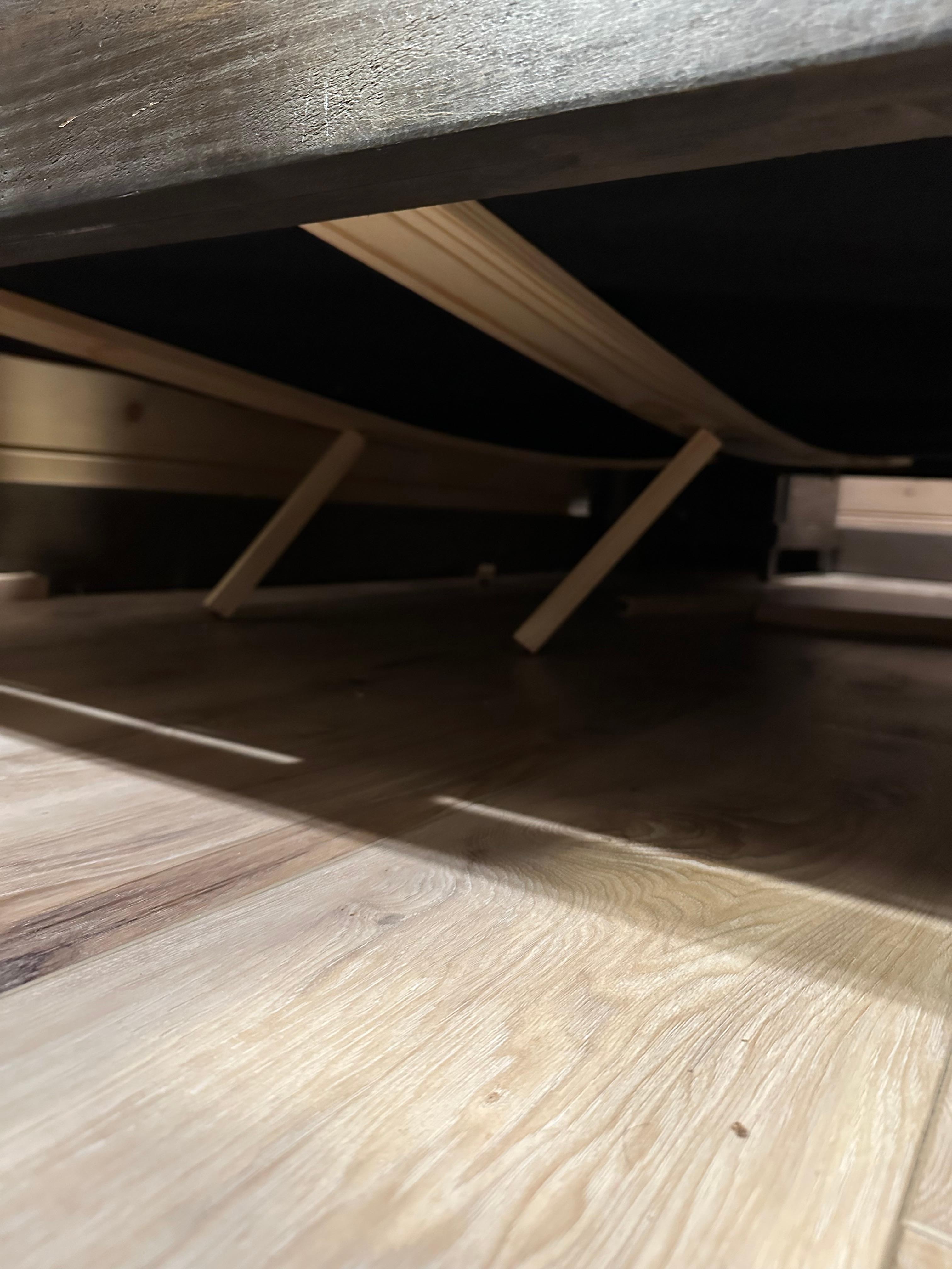 The original problem with the collapsed bed. When fixed the first time- they just propped these 1x1 sticks back under with nothing to secure them.  After I complained the second time- they came and put some 2x4s under and bed was finally solid. 