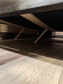 The original problem with the collapsed bed. When fixed the first time- they just propped these 1x1 sticks back under with nothing to secure them. After I complained the second time- they came and put some 2x4s under and bed was finally solid.