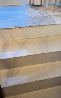 Broken tile on steps to patio Dangerous