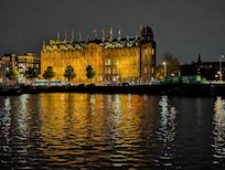 Night view of the hotel from across the river.