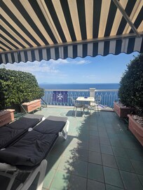 View from Room W/Balcony. It's definitely worth the extra $ to get room with Balcony view of sea.