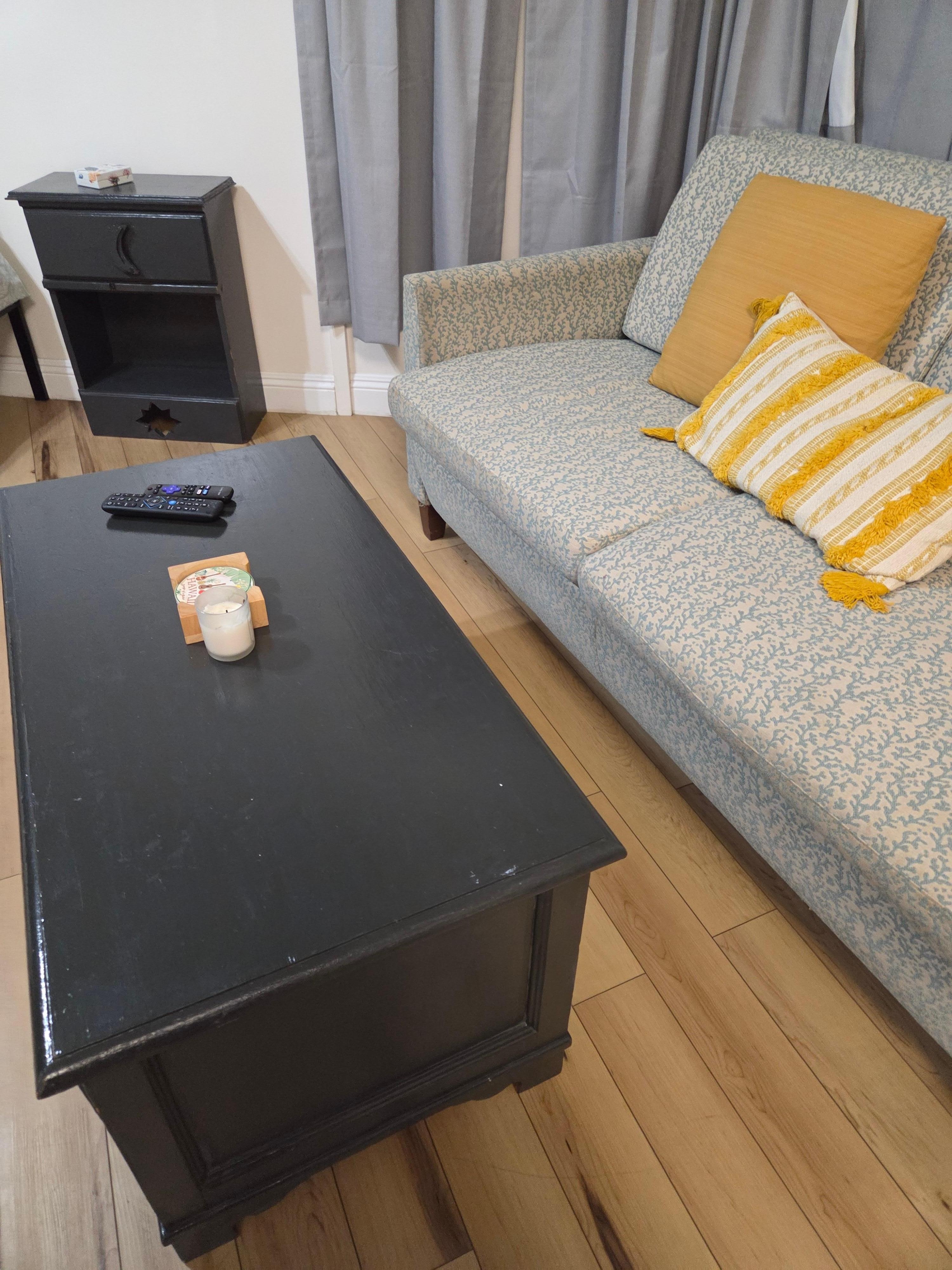 Living room area with extra bedding.