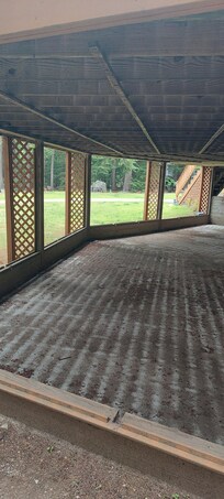 Dirt floor and all screens removed from screened porch
