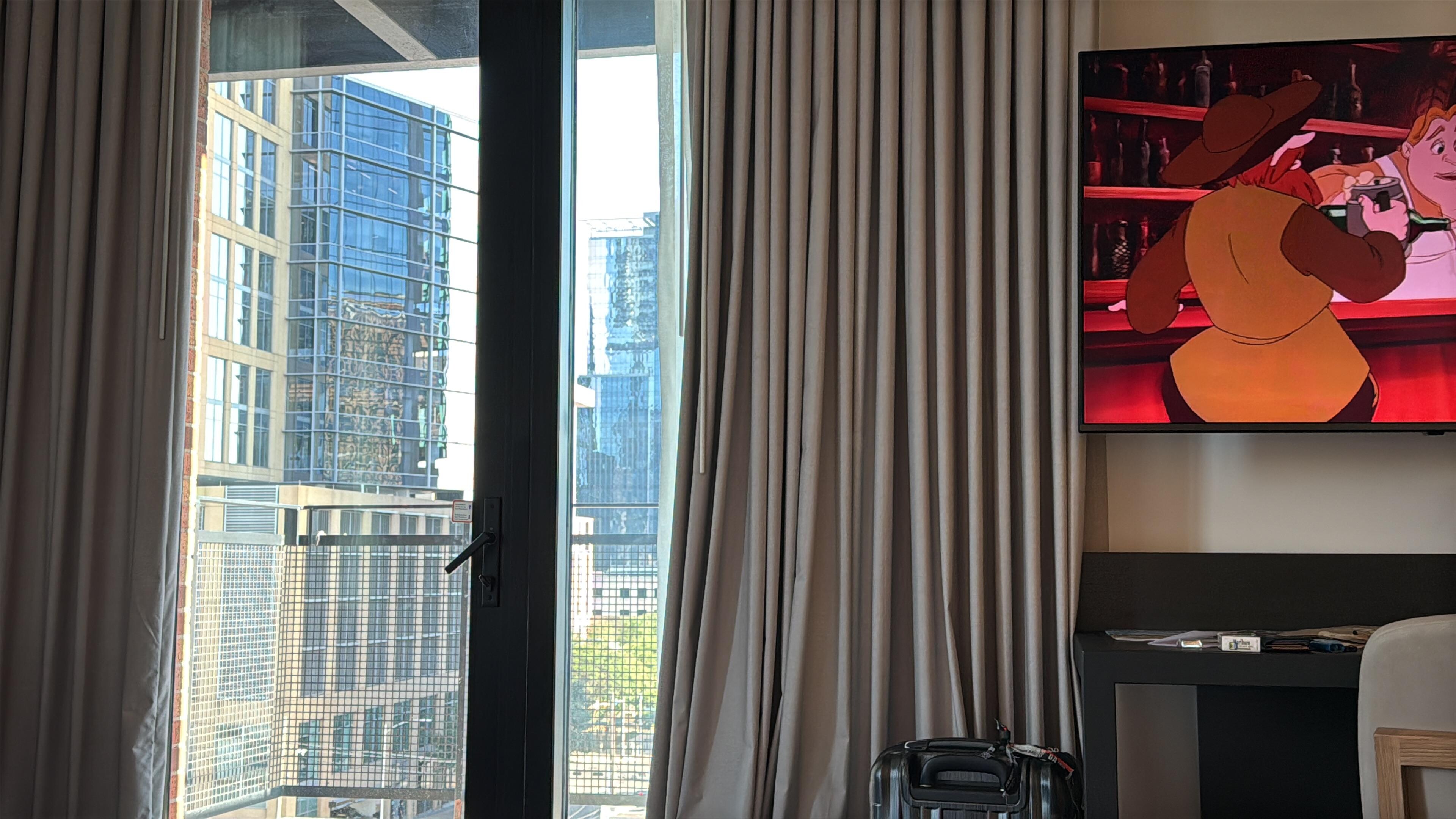 Corner balcony room, spacious with a small couch. 