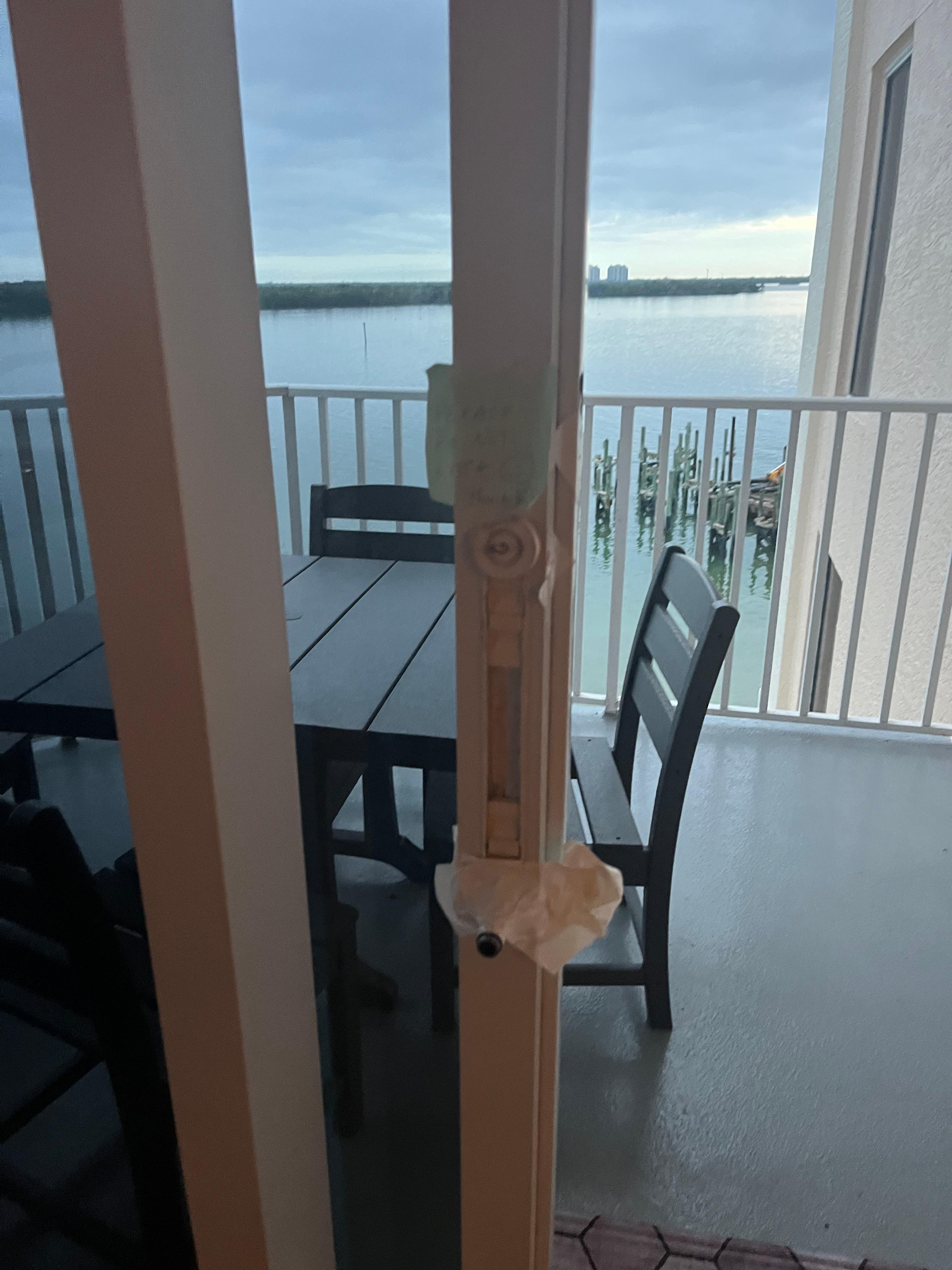 Broken sliding door handle white duct tape to hold it to the door