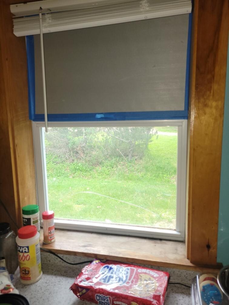 Top of window was a wood/plastic panel, bottom was broken glass. 