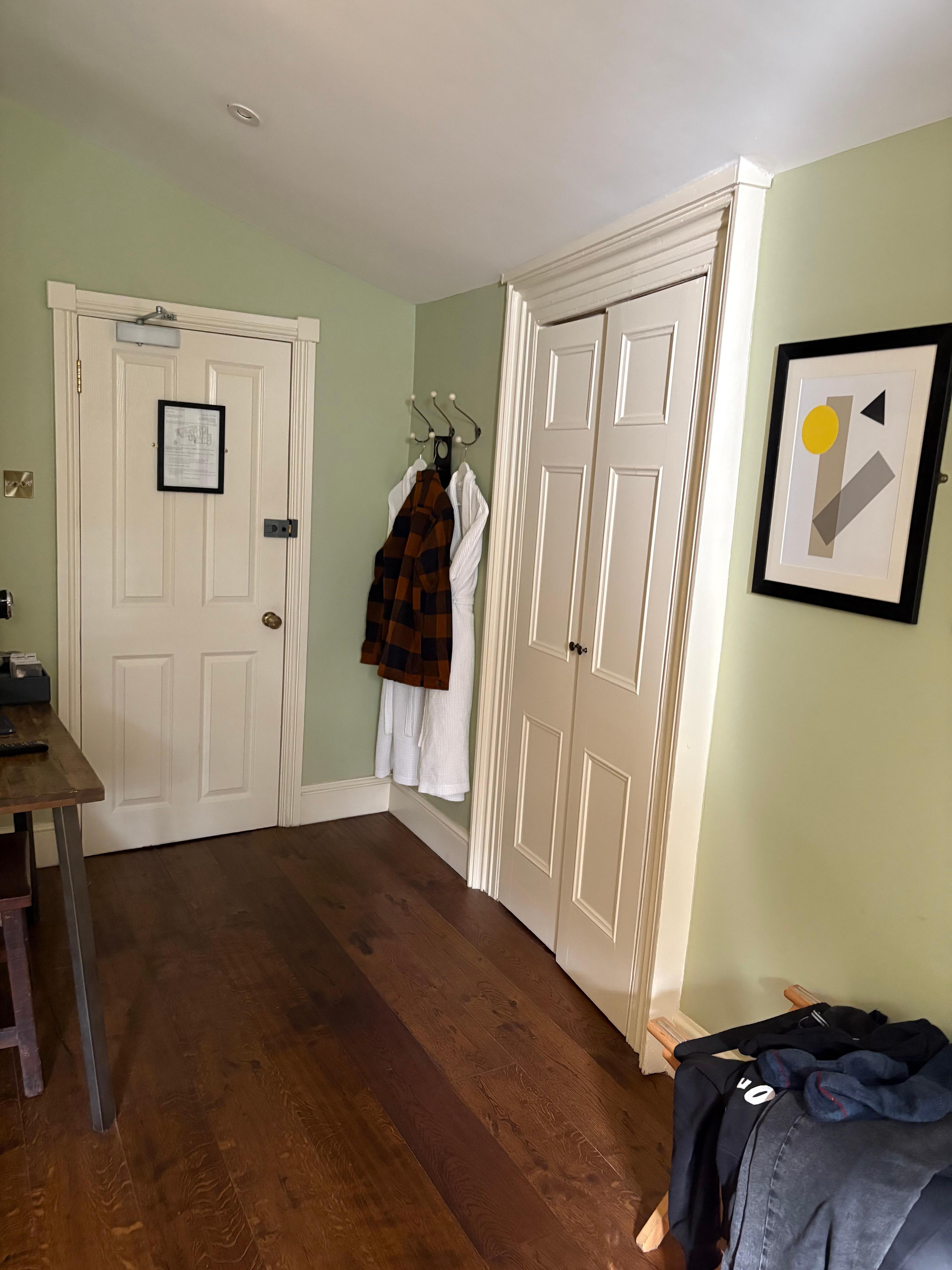 Bid walk way with robes and massive wardrobe