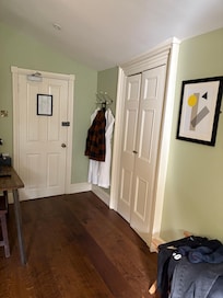 Bid walk way with robes and massive wardrobe