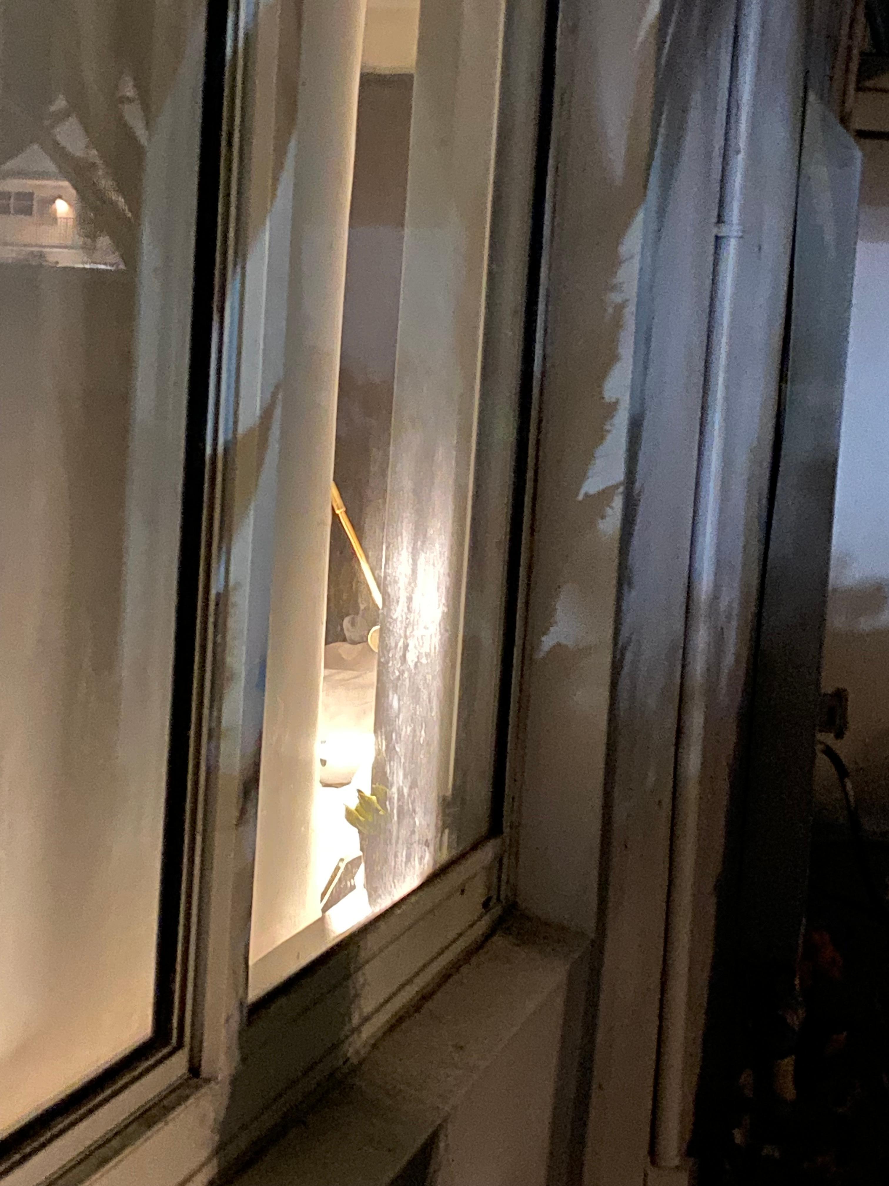 Direct view of the bed inside from the main public walkway outside