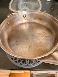 Molded and crusted pan that was in the dishwasher