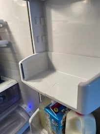 Broken shelf in refrigerator