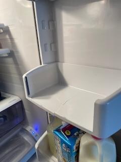 Broken shelf in refrigerator