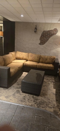 Comfy couches in pool and sauna area.