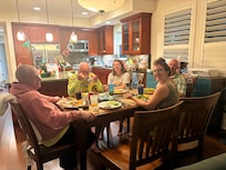 Enjoying eating the fish the men caught on deep sea fishing trip. Grills were a wonderful amenity!