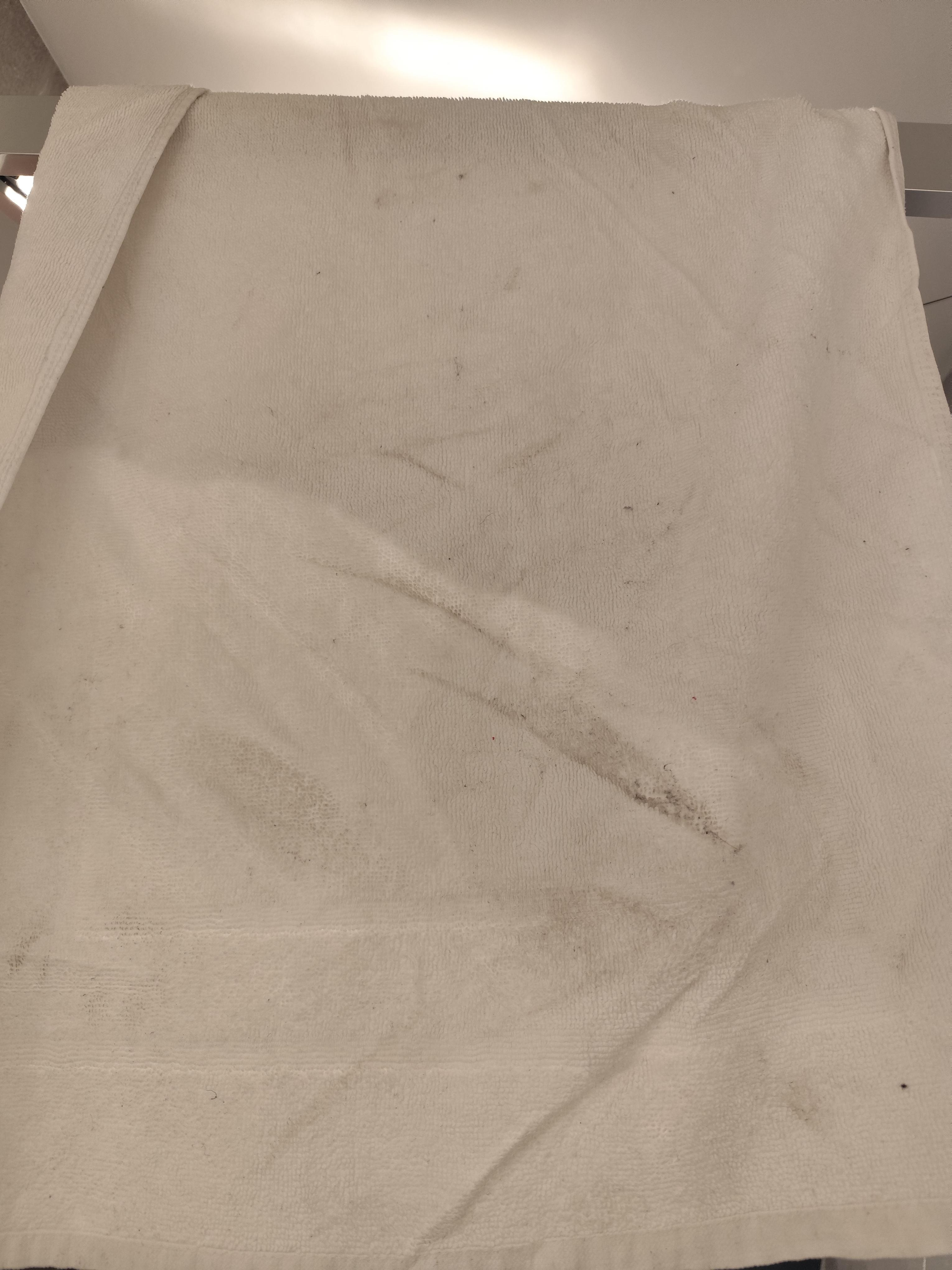 Our bath mat after one shower. This dirt was from the floor.