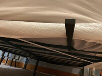 Under the a long pole stuck out from under the bed. Scrapped my leg on it.