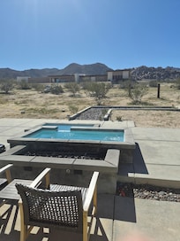 You can sit in the hot tub and watch the sun rise over the distant mountains. Very inspiring.