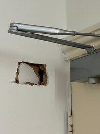 Hole behind door