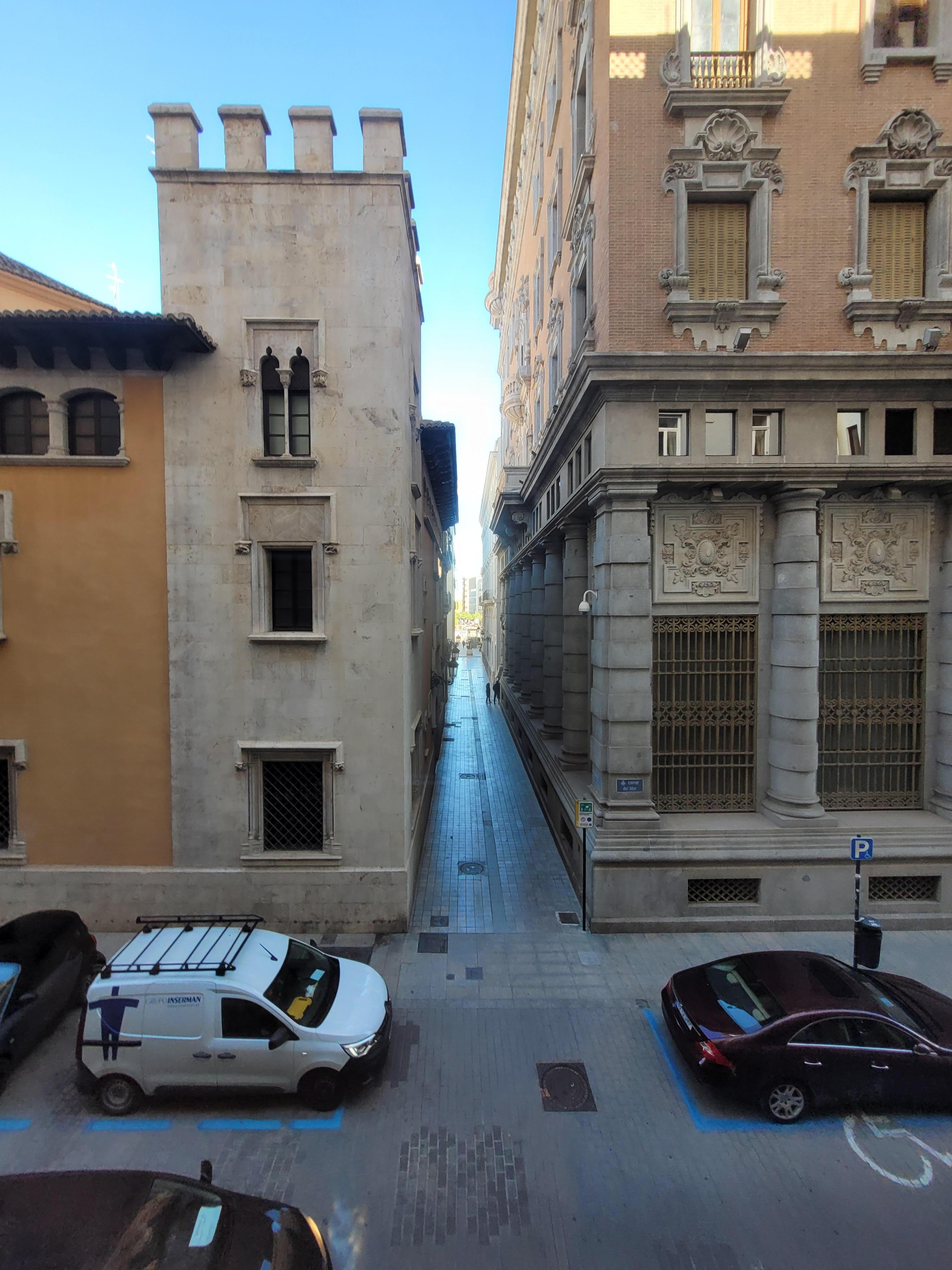 View from room - a sliver of the Turia Park is visible at end of street.