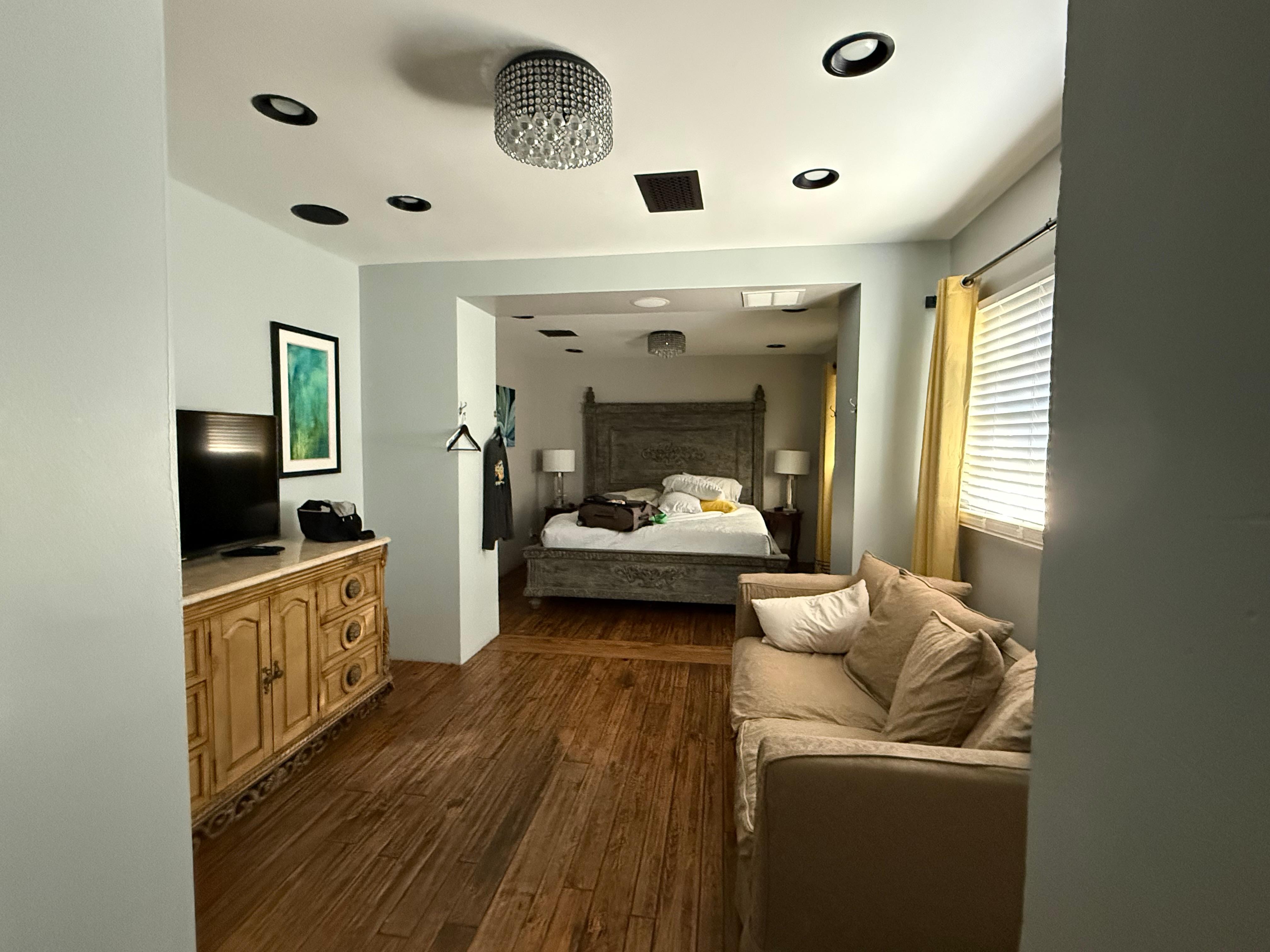 Larger bedroom with lounge area