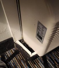 Gross space full of spider webs and dirt.