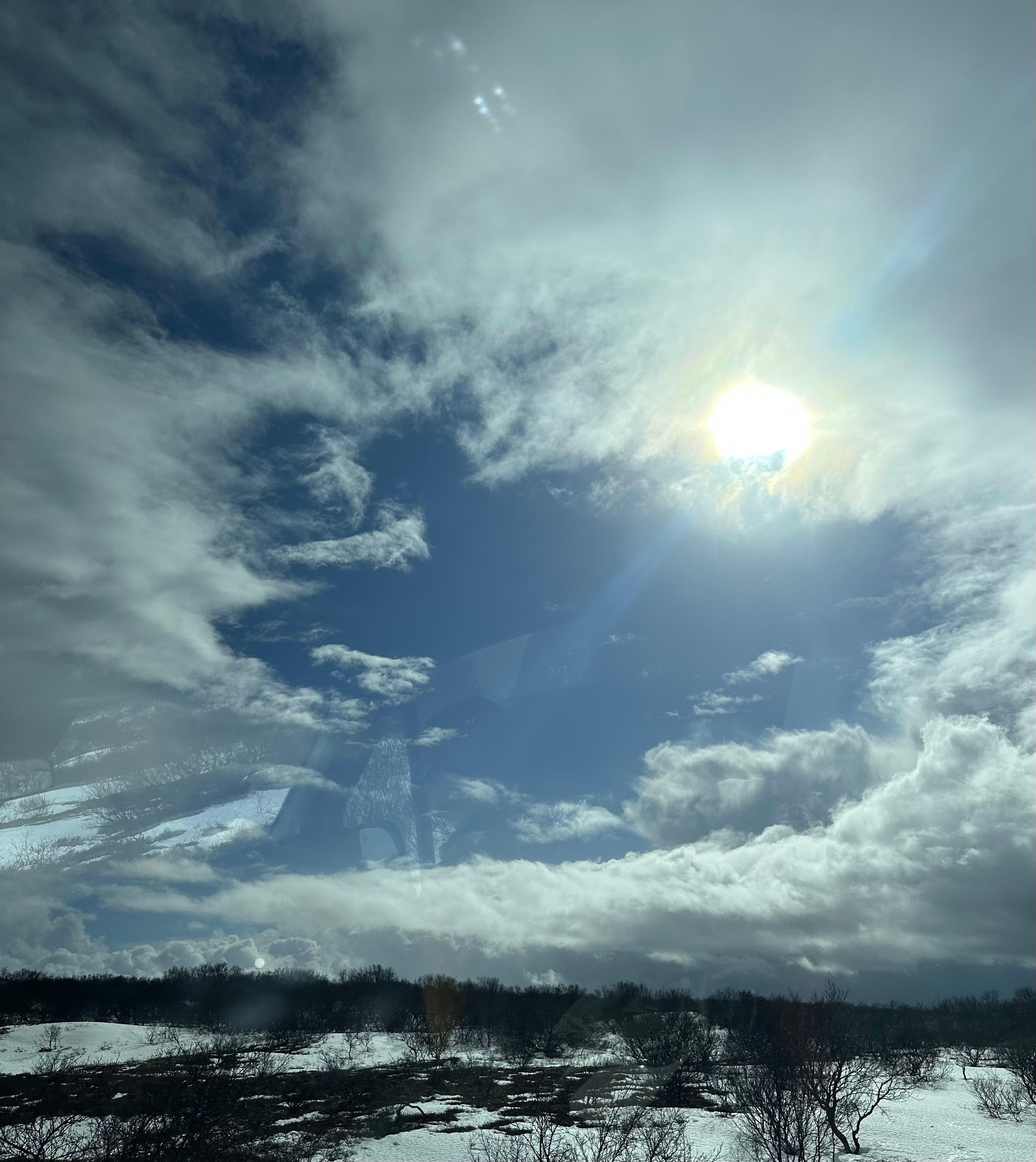 Sun in and out of clouds