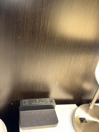 Dusty wall behind bed.