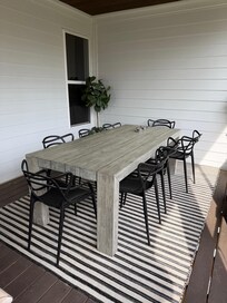 Screened porch dining area.