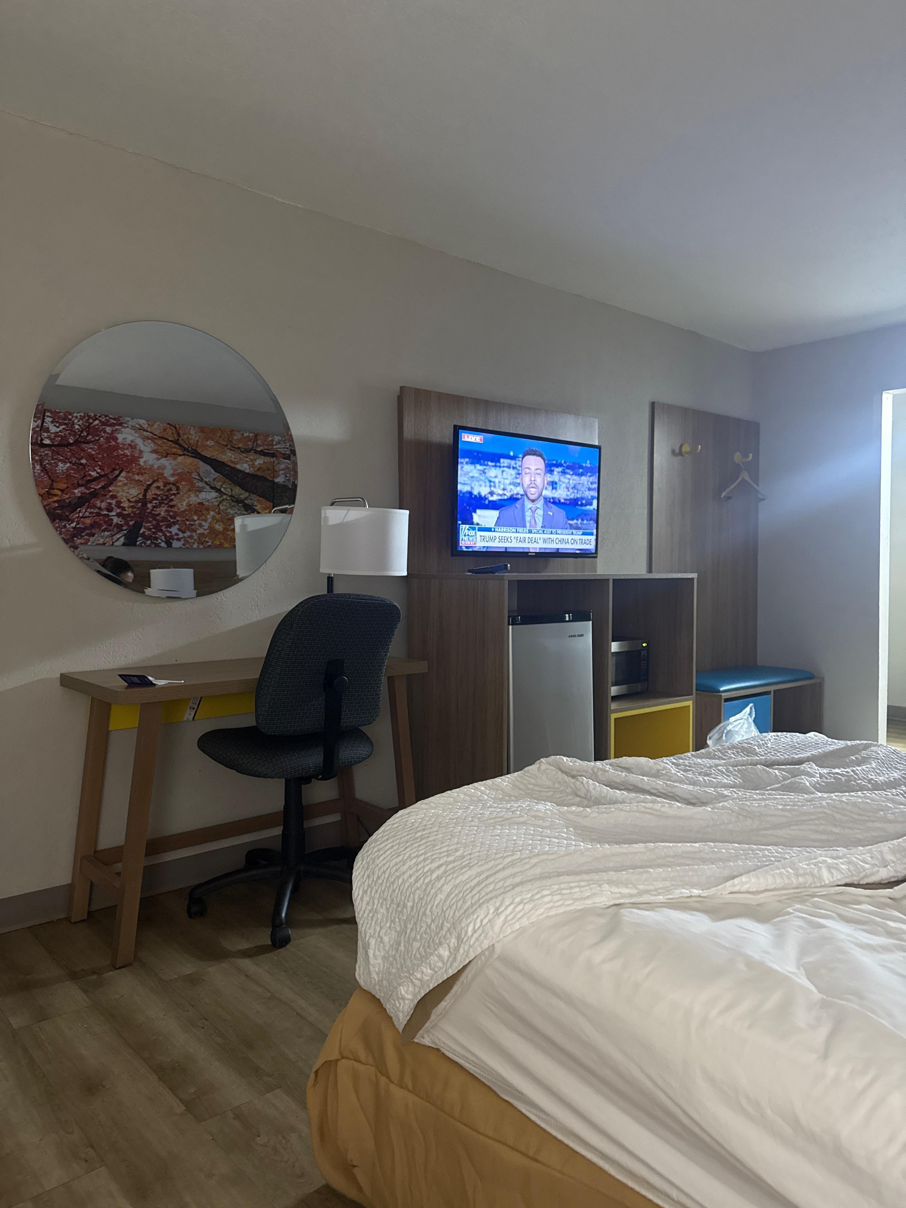 This is inside of a room, bottom floor getting ready to leave in the morning to the bed is messed up