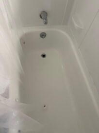 Old tub with rust spots on the bottom