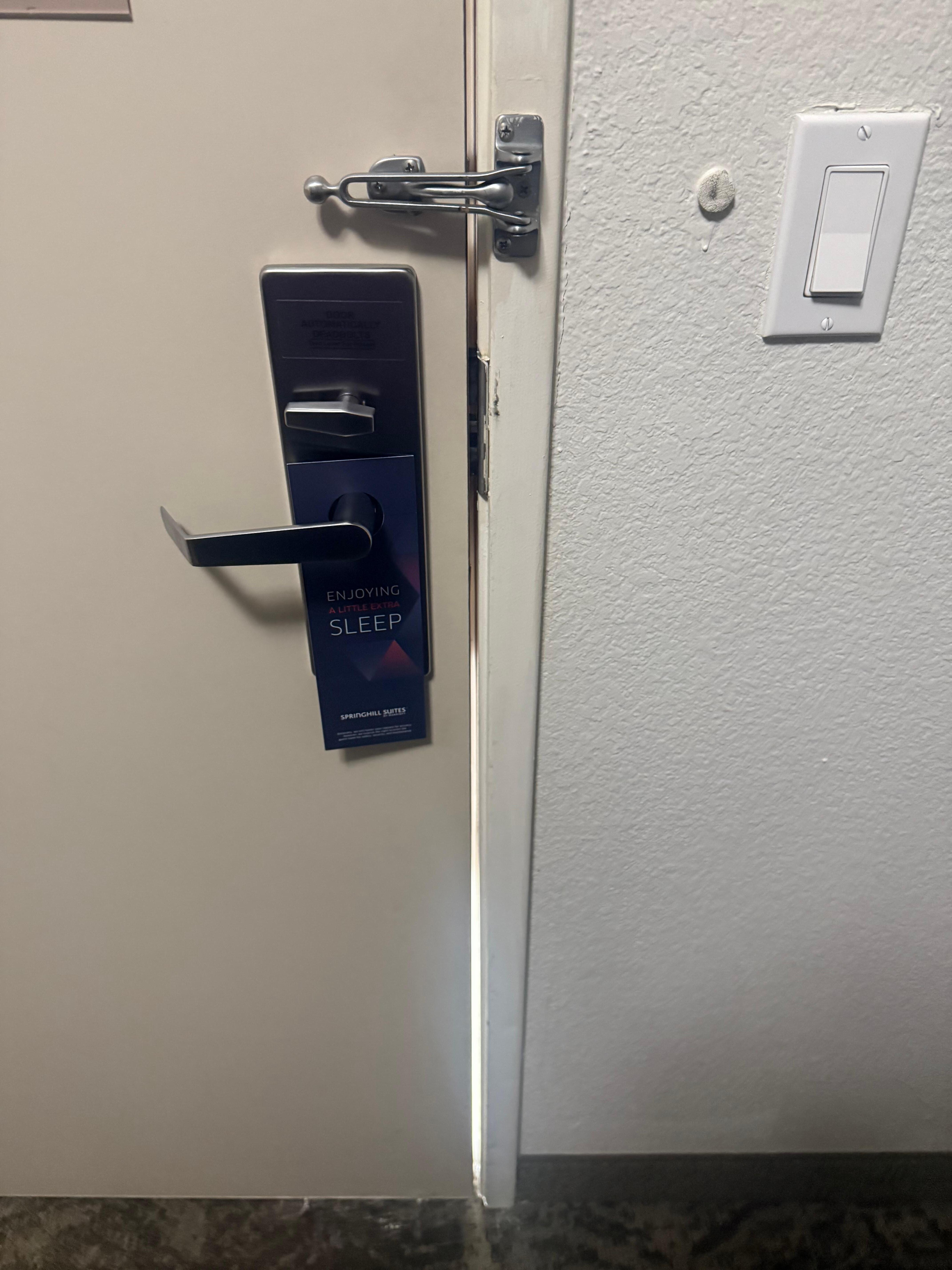 Door has large gap, felt unsafe and it is right by back door to street, vagrants walking sround
