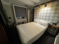 barely room to walk around the bed