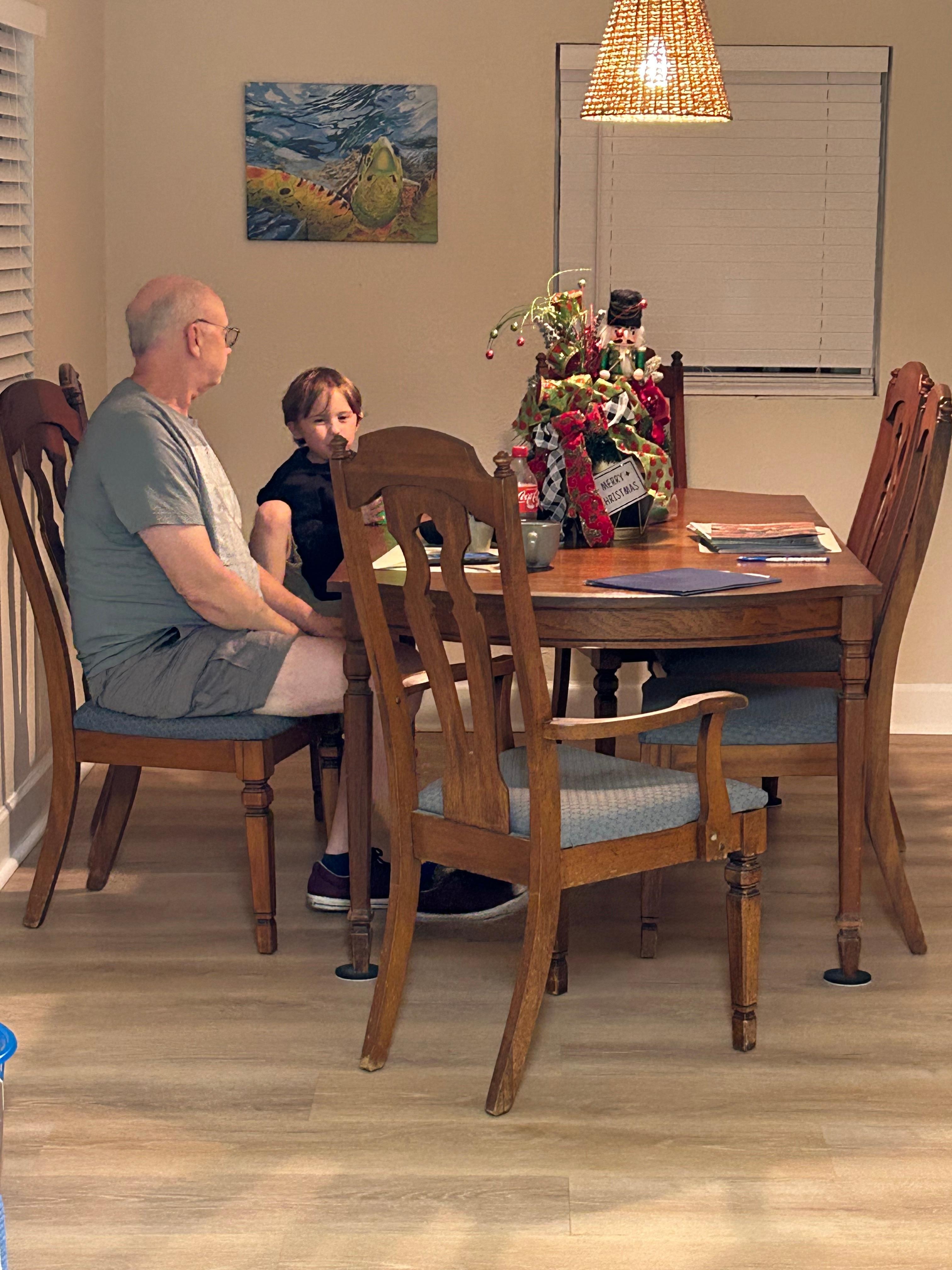 Enjoying breakfast in open dining room to the kitchen. 