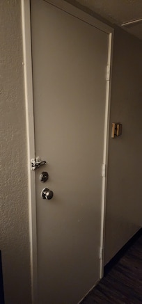 Broken door leading to another guests room