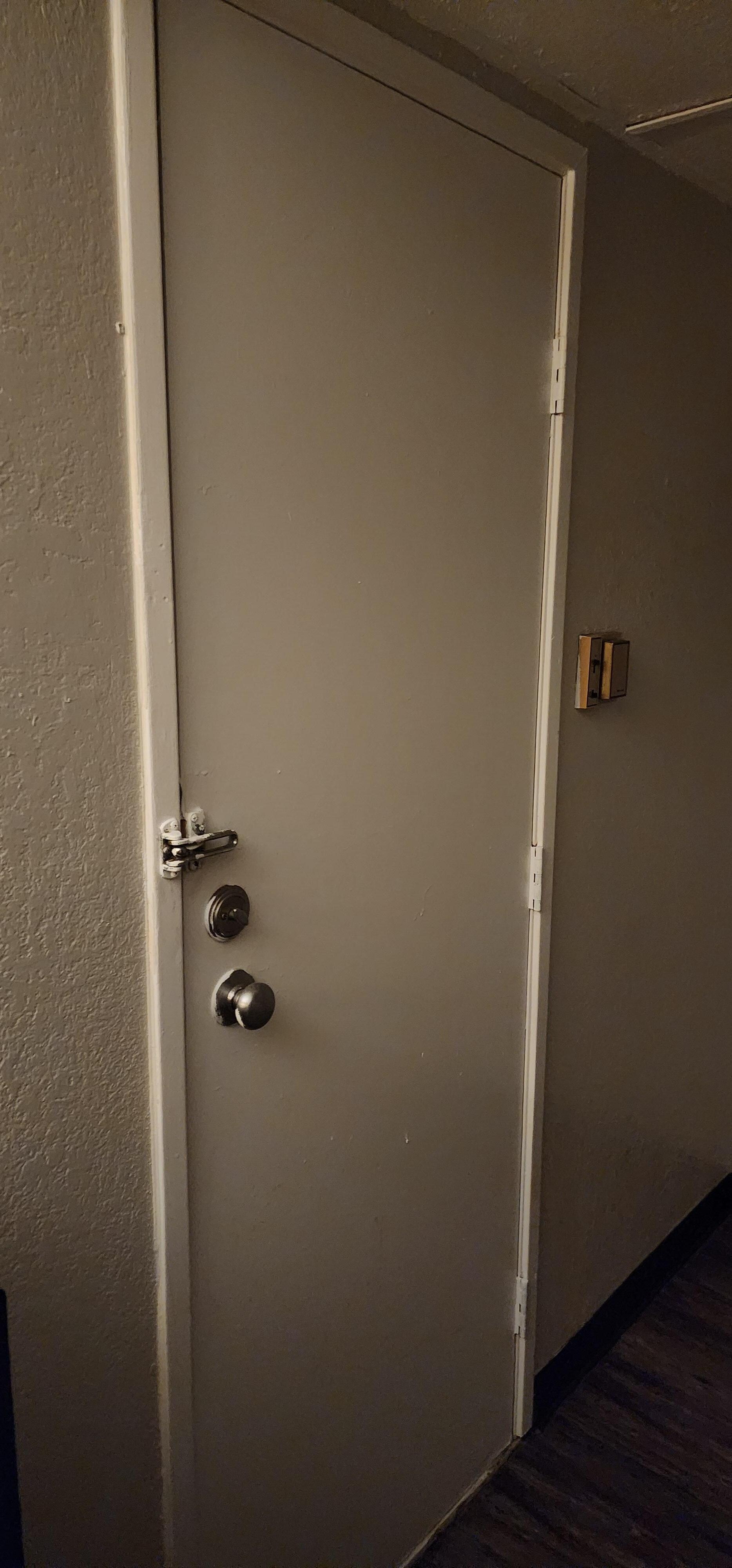 Broken door leading to another guests room