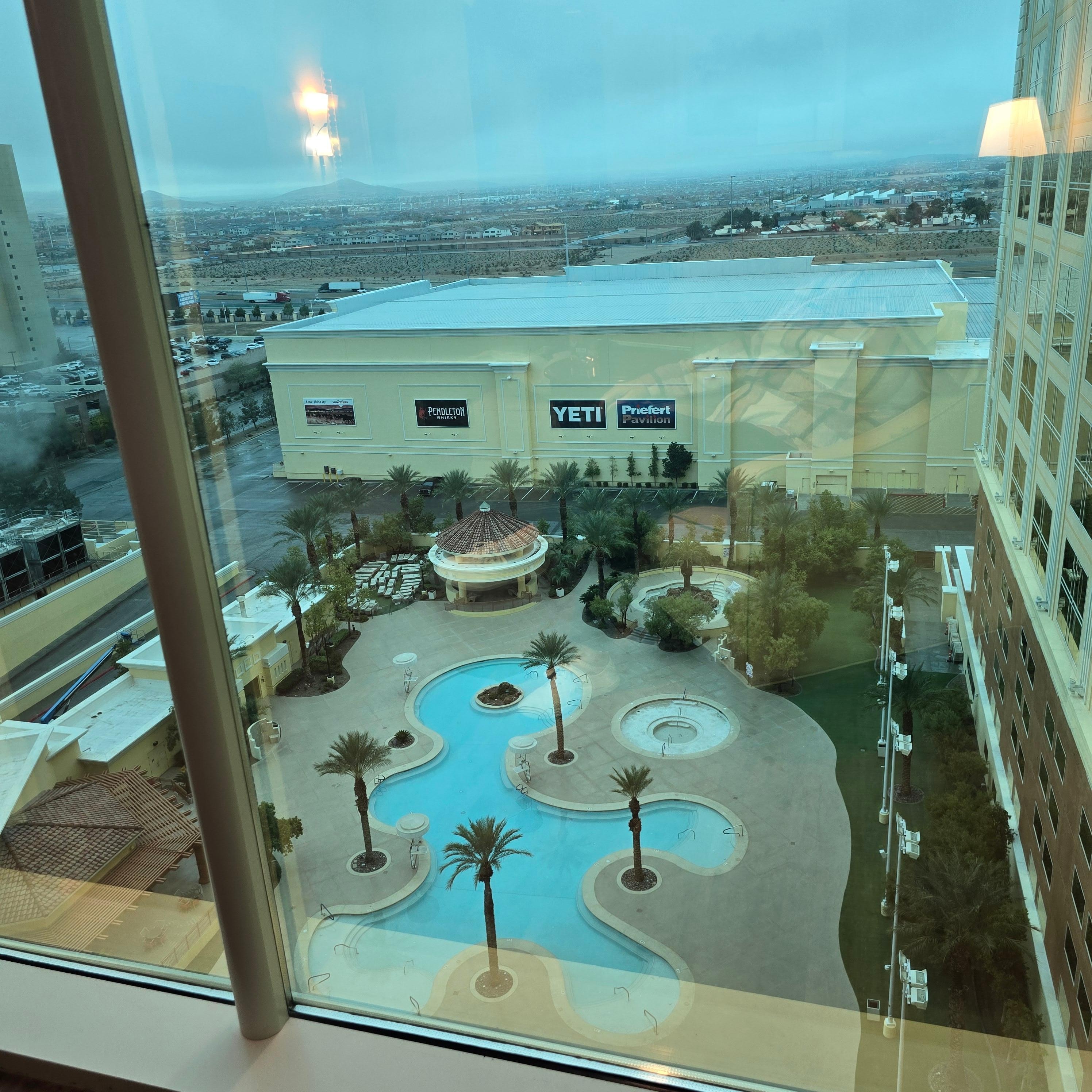 Premium view overlooking pool and jacuzzi as well as distant Henderson.