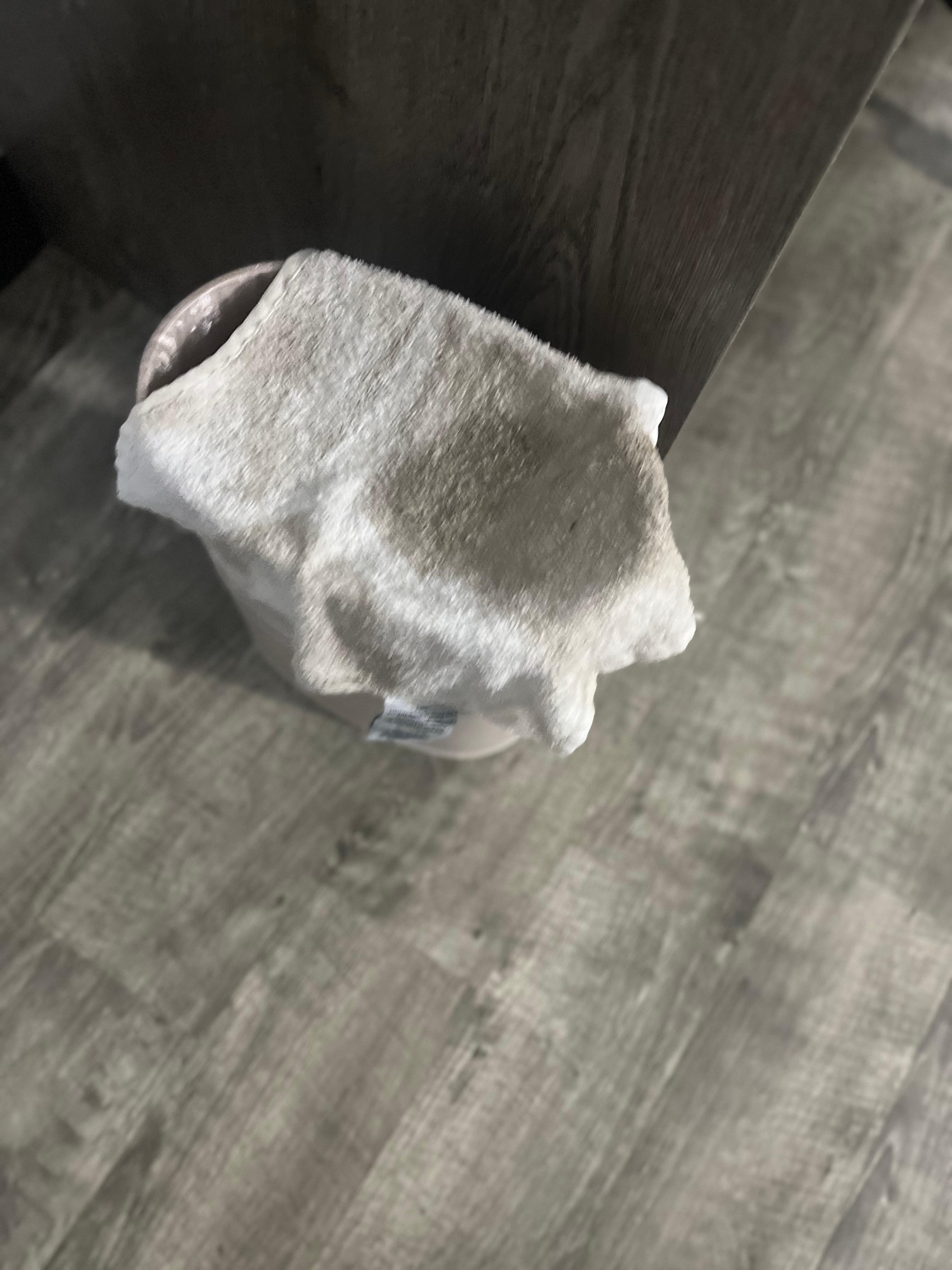 Wash rag used to wipe up water on bathroom floor