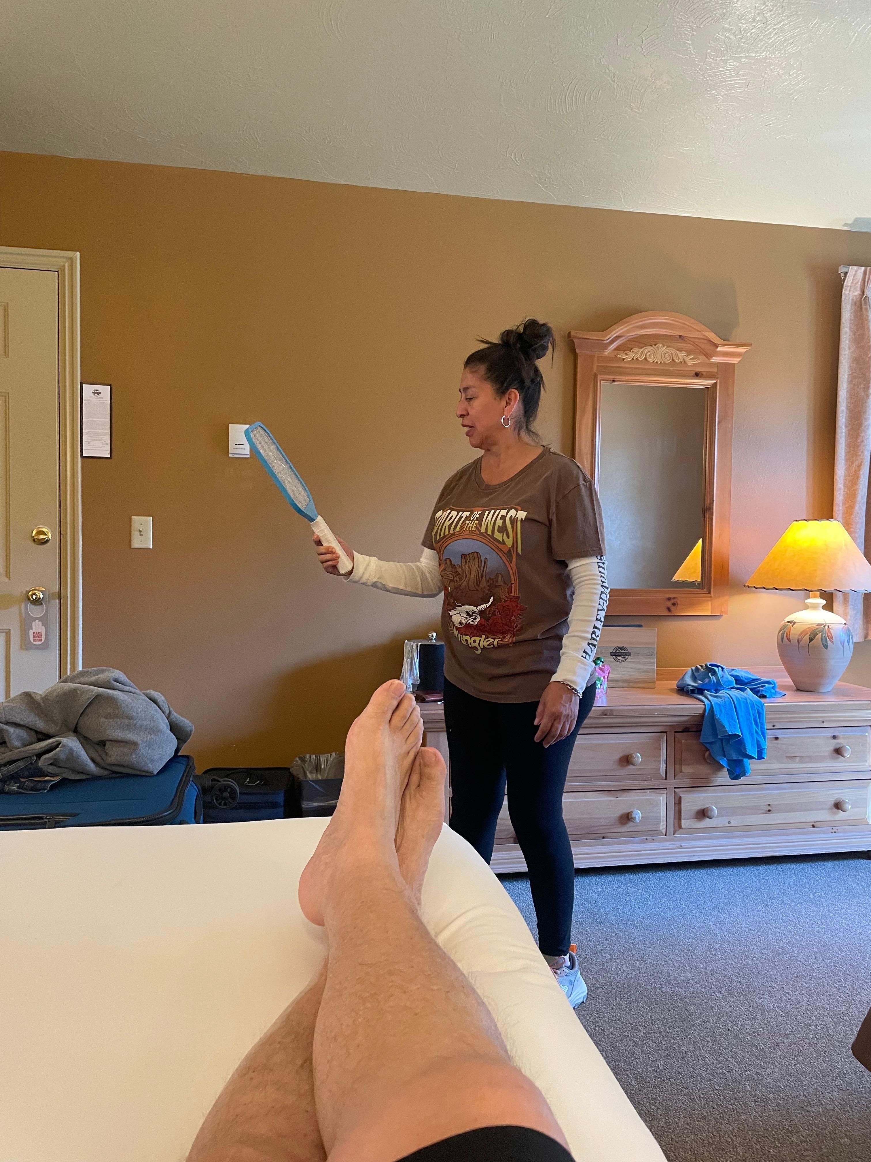 Wife killing mosquitoes in are room .