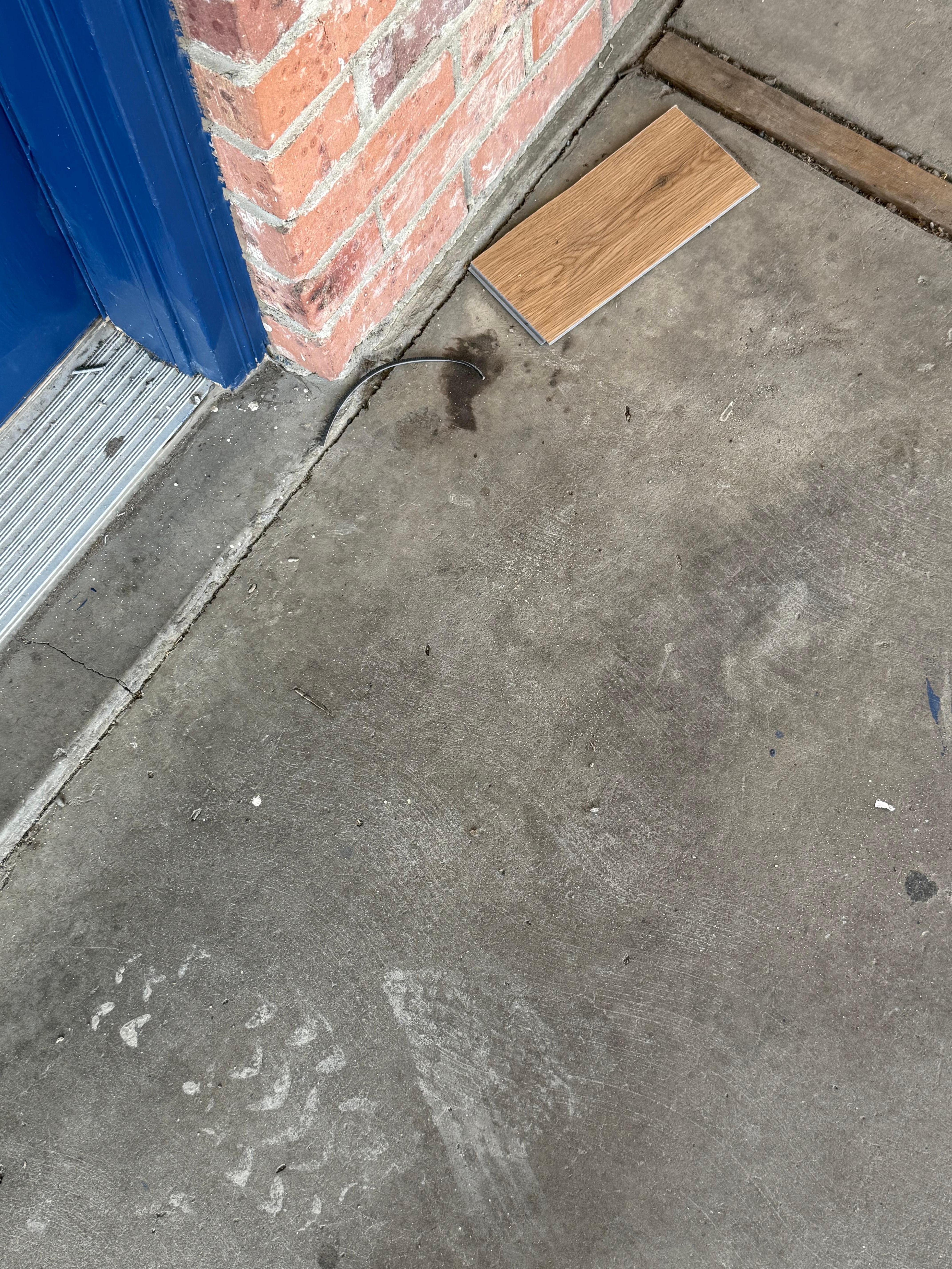 Filthy walkway outside entry door